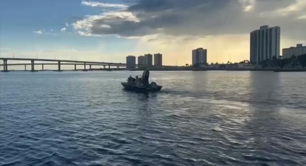 Bridges seen with boat in the water in North Fort Myers.