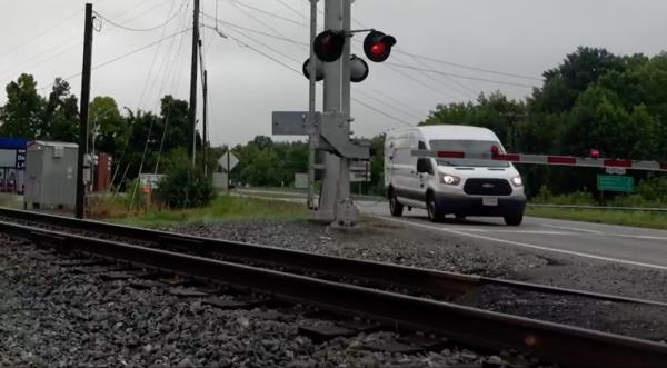 A train enthusiast captured the heart-pounding moment a train nearly tore a Pepsi van to shreds in Virginia.