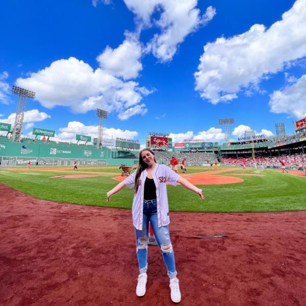 Ali Berke, young pop singer, standing on a ba<em></em>seball field, ready to perform the natio<em></em>nal anthem