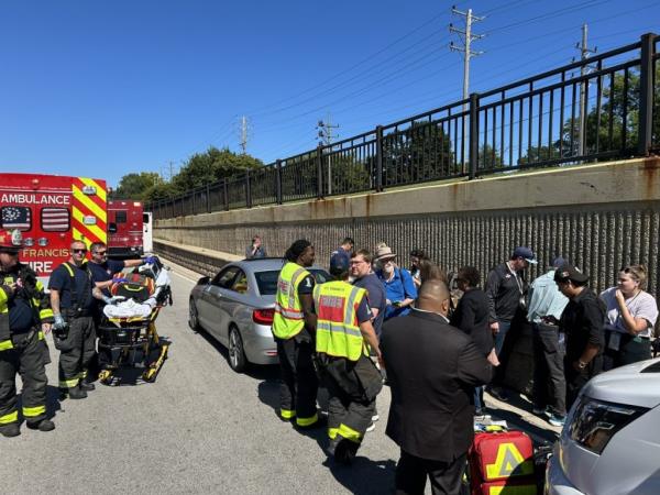 EMTs gather at the scene of the crash