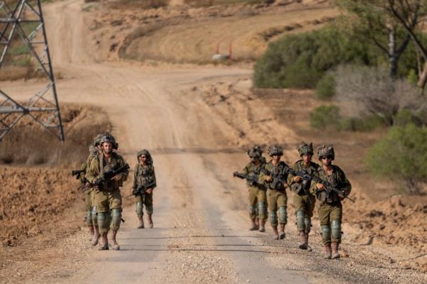 Israeli soldiers are seen near the Gaza Strip border in southern Israel, Thursday, June 13, 2024. 