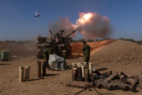 An Israeli mobile artillery unit fires a shell from southern Israel towards the Gaza Strip, in a position near the Israel-Gaza border, Nov. 6, 2023.