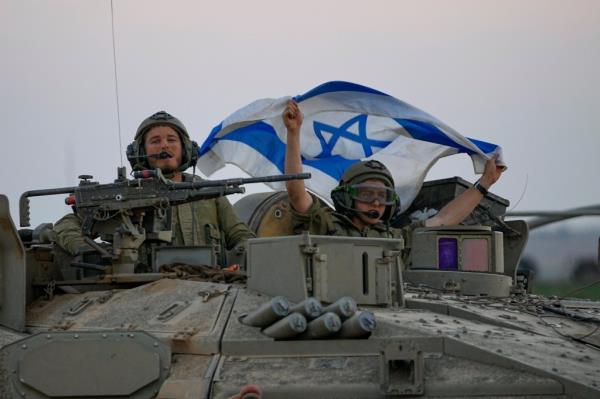 Israeli tanks head towards the Gaza Strip border in southern Israel on Thursday, Oct.12, 2023.