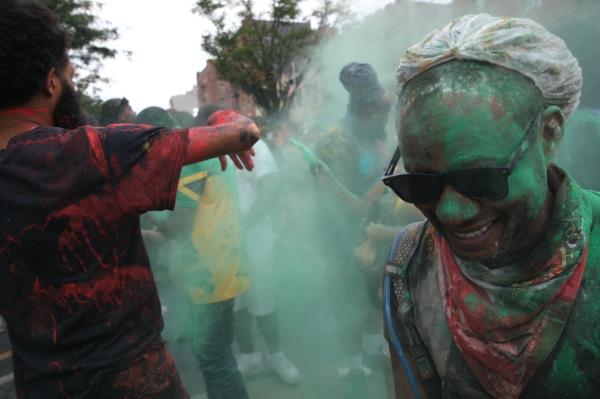 People participate in the annual J'Ouvert festival celebration on Monday, September 2, 2024 