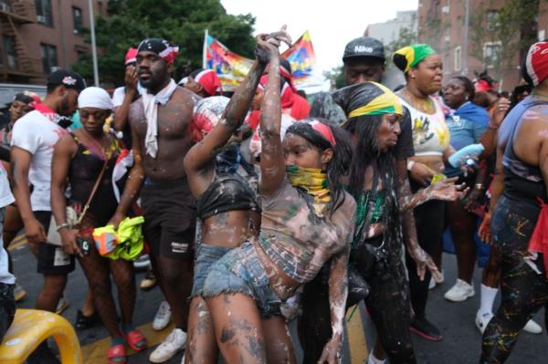 People participate in the annual J'Ouvert festival celebration on Monday, September 2, 2024 