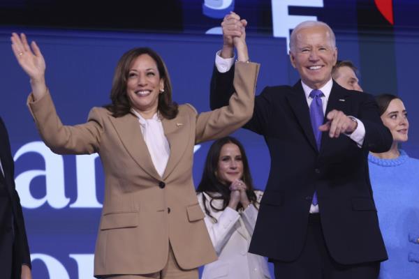 U.S. President Joe Biden and Vice President Kamala Harris waving to the audience at the Democratic Natio<em></em>nal Co<em></em>nvention in Chicago, Illinois, 19 August 2024